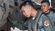 This file handout photo from Taiwan's Ministry of National Defense released on April 9, 2023 shows a Taiwanese air force fighter pilot, seen wearing an embroidered patch on his left shoulder in an undisclosed location in Taiwan. (Photo by Handout / Taiwan's Ministry of National Defense / AFP) 