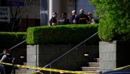 APRIL 10: Law enforcement officers gather outside the front entrance of the Old National Bank building after a gunman opened fire on April 10, 2023 in Louisville, Kentucky. Photo by LUKE SHARRETT / GETTY IMAGES NORTH AMERICA / Getty Images via AFP