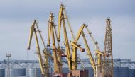 A photo taken on April 10, 2023 shows cranes at the grain terminal of the port of Odessa, Ukraine, from where Ukraine ships wheat according to the grain agreement the country currently has with Russia. (Photo by Bo Amstrup / Ritzau Scanpix / AFP)