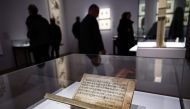 Visitors walks past the Jikji, a Korean book dating from 1377 and 