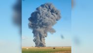 This image obtained from the Facebook page of Castro County Sheriff's Office shows a plume of smoke rising from the Southfork Dairy Farms, after an explosion and a fire killed around 18,000 cows, near Dimmitt, Texas, on April 11, 2023. Photo by Castro County Sheriff's Office / AFP