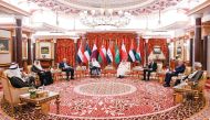 Prime Minister and Minister of Foreign Affairs H E Sheikh Mohamed bin Abdulrahman bin Jassim Al Thani with other participants during the meeting.