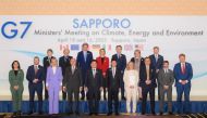This handout photo taken and released on April 15, 2023 by the Japanese Government痴 official photographer shows a group photo of participants in the G7 Ministers' Meeting on Climate, Energy and Environment in Sapporo, Hokkaido prefecture on April 15, 2023. (Photo by Handout / Japanese Government / AFP)