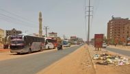 Buses are parked along a deserted street as people flee the southern part of Khartoum on April 27, 2023 amid street battles between the army and paramilitaries continue. (Photo by AFP)