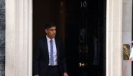 Britain's Prime Minister Rishi Sunak comes out from 10 Downing Street to welcome Rwanda's President Paul Kagame, in cental London on May 4, 2023 ahead of a meeting. (Photo by Daniel LEAL / AFP)