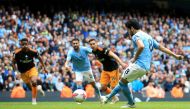 Manchester City's German midfielder Ilkay Gundogan (R) kicks and misses a penalty during the English Premier League football match between Manchester City and Leeds United at the Etihad Stadium in Manchester, north west England, on May 6, 2023. (Photo by Lindsey Parnaby / AFP)