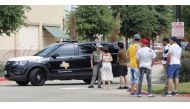 Residents return in an effort to retrieve their vehicles at the scene of a shooting at Allen Premium Outlets on May 7, 2023 in Allen, Texas. (Photo by Stewart F. House / Getty Images via AFP)
