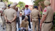 Punjab policemen inspect the site of a blast in Heritage Street near the Golden Temple in Amritsar on May 7, 2023. (Photo by Narinder NANU / AFP)