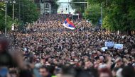 Demonstrators march during a rally to call for the resignation of top officials and the curtailing of violence in the media, just days after back-to-back shootings stunned the Balkan country, in Belgrade on May 8, 2023. (Photo by ANDREJ ISAKOVIC / AFP)