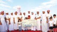 Katara General Manager, Prof. Dr. Khalid bin Ibrahim Al Sulaiti awarding the winning team. 