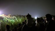 Migrants cross the Rio Grande River as they try to get to the US, from Matamoros, state of Tamaulipas, Mexico, on May 11, 2023. (Photo by ALFREDO ESTRELLA / AFP)
