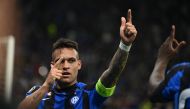 Inter Milan's Argentinian forward Lautaro Martinez (L) and AC Milan's French forward Olivier Giroud embrace at the end of the UEFA Champions League semi-final second leg football match between Inter Milan and AC Milan on May 16, 2023 at tyhe Giuseppe-Meazza (San Siro) stadium in Milan. (Photo by Marco BERTORELLO / AFP)
