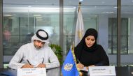 Director of QOC Support Services Sector Hamad Lahdan Al Mohannadi and Director of Al Jazeera Media Institute Iman Ahmed Al Amri signing the contract. 