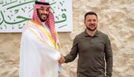 This handout picture provided by the Saudi Royal Palace on May 19, 2023 shows Saudi Crown Prince HRH Mohammed bin Salman with Ukraine's President Volodymyr Zelensky prior to the Arab Summit meeting in Jeddah. (Photo by Bandar Al-Jaloud / Saudi Royal Palace / AFP)