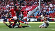 Nottingham Forest's Nigerian striker Taiwo Awoniyi scores the opening goal during the English Premier League football match between Nottingham Forest and Arsenal at The City Ground in Nottingham, central England, on May 20, 2023. (Photo by Darren Staples / AFP)