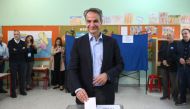 Greek Prime Minister and leader of right wing party New Democracy, Kyriakos Mitsotakis casts his ballot at a polling station during the general election in Athens on May 21, 2023. (Photo by Angelos Tzortzinis / AFP)
