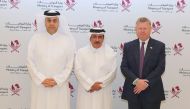 Minister of Transport H E Jassim Saif Ahmed Al Sulaiti with Mwani Qatar’s CEO Capt Abdulla Mohamed Al Khanji (left) and GCEO of QTerminals Neville Bissett (right). 