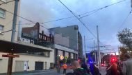 This picture shows a fire at a building in Sydney on May 25, 2023. (Photo by Andrew Leeson / AFP)