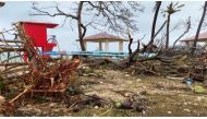 This video capture from James Reynolds' Twitter page @EarthUncutTV shows damage on the shoreline caused by high winds and precipitation a day after Typhoon Mawar passed over Tumon Bay, Guam, May 25, 2023. Photos by James REYNOLDS / AFP

