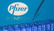 File Photo: Test tubes are seen in front of displayed Pfizer and Biontech logos in this illustration taken, May 21, 2021.(REUTERS/Dado Ruvic)