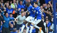 Everton's French midfielder Abdoulaye Doucoure (C) celebrates with teammates after scoring a goal during the English Premier League football match between Everton and Bournemouth at Goodison Park in Liverpool, northwest England, on May 28, 2023. (Photo by PETER POWELL / AFP) 


