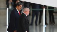 Venezuela's President Nicolas Maduro (L) walks with Brazilian President Luiz Inacio Lula da Silva during a welcome ceremony at Planalto Palace in Brasilia on May 29, 2023. (Photo by EVARISTO SA / AFP)
