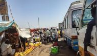 People shop for fresh produce at a market in southern Khartoum, during a lull amid ongoing fighting between two rival Sudanese generals, on May 31, 2023. (Photo by AFP)