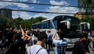 Chinese fans cheer as members of Argentina's football team arrive at a hotel in Beijing on June 10, 2023. (Photo by Jade GAO / AFP)