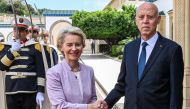 This handout picture provided by the Tunisian Presidency Press Service shows Tunisia's President Kais Saied (right) shaking hands with European Commission President Ursula von der Leyen at Carthage Palace in Carthage on the eastern outskirts of the Tunisian capital on June 11, 2023. (Photo by Tunisian Presidency / AFP) 
