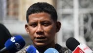 Indigenous Manuel Ranoque, father of the four Indigenous children who were found alive after being lost for 40 days in the Colombian Amazon rainforest following a plane crash, speaks with the press before arriving at the Military Hospital, where the children were hospitalized, in Bogota on June 11, 2023. (Photo by Raul Arboleda / AFP) 