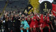 Ahly's players celebrate with the trophy after winning the CAF Champions League final football match between Morocco's Wydad AC and Egypt's Al-Ahly at the Mohammed V Stadium in Casablanca on June 11, 2023. (Photo by Fadel Senna / AFP)