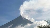 This handout photo made available by Kristin Moral shows the Mount Mayon spewing white smoke as seen from Camalig, Albay, in the Philippines, on June 8, 2023. (Photo by Handout / AFP)