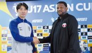 Qatar coach Mohammud Shafie (right) and Korea Republic head coach Byun Sung-hwan shake hands on the eve of the match. 