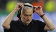File photo: AS Roma's Portuguese coach Jose Mourinho takes off his runners-up medal after the UEFA Europa League final football match between Sevilla FC and AS Roma at the Puskas Arena in Budapest on May 31, 2023. AS Roma's Portuguese coach Jose Mourinho given four-match ban for insulting referee (Photo by Odd ANDERSEN / AFP)