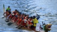 Competitors take part in dragon boat races held to celebrate the Tuen Ng festival in the Aberdeen typhoon shelter in Hong Kong on June 22, 2023. (Photo by Peter PARKS / AFP)
