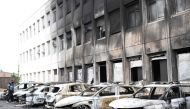 Seven burnt out vehicles are seen outside the municipal police building following violence in Neuilly-sur-Marne on June 29, 2023, following riots two days after a 17-year-old boy was shot in the chest by police at point-blank range in Nanterre, a western suburb of Paris. (Photo by Bertrand GUAY / AFP)
