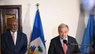 Jean Victor Geneus, Haiti's Minister of Foreign Affairs, looks on as UN Secretary-General Antonio Guterres speaks during a press conference in Port-au-Prince on July 1, 2023. (Photo by Richard Pierrin / AFP)