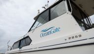File Photo: The OceanGate logo is pictured on a boat at the Port of Everett Boat Yard in Everett, Washington, on June 20, 2023. (Photo by Jason Redmond / AFP)