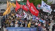 South Korean protesters stage a rally against Japan's plan to discharge treated water from the Fukushima nuclear plant, on a road near the Japanese embassy in Seoul on July 8, 2023. (Photo by Jung Yeon-je / AFP)