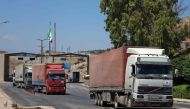 File Photo: A picture taken on July 28, 2022 shows the entry of the first United Nations aid convoy through the Bab al-Hawa border crossing with Turkey, after the decision to extend the authorisation mechanism across the border. (Photo by Ahmad al-Atrash / AFP)
