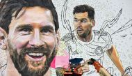 Argentine artist Maximiliano Bagnasco paints a giant mural of socer star Lionel Messi in Wynwood, Miami art district, in Miami, Florida on July 10, 2023. (Photo by CHANDAN KHANNA / AFP)