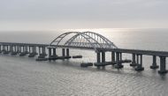 (Files) This picture taken on December 23, 2019, shows the Crimean Bridge that spans the Kerch Strait, a narrow strip that links the Azov and Black seas. (Photo by Alexey Nikolsky / AFP)