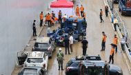 Damaged cars are retrieved from an underground tunnel, where some 15 cars were trapped in floodwaters after heavy rains, in Cheongju early on July 17, 2023. Photo by YONHAP / AFP
