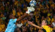 Nigeria's goalkeeper #16 Chiamaka Nnadozie (L) makes a save during the Australia and New Zealand 2023 Women's World Cup Group B football match between Australia and Nigeria at Brisbane Stadium in Brisbane on July 27, 2023. (Photo by Patrick Hamilton / AFP)