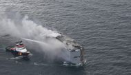 This handout photograph taken and released on July 26, 2023 by the Dutch coastguards, shows a fire aboard the Panamanian-registered car carrier ship Fremantle Highway, off the coast of the northern Dutch island of Ameland. Photo by Handout / Netherlands Coastguards / AFP