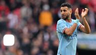 Manchester City's Algerian midfielder Riyad Mahrez applauds the fans following the English FA Cup semi-final football match between Manchester City and Sheffield United at Wembley Stadium in north west London on April 22, 2023. Photo by Glyn KIRK / AFP