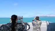 This handout photo taken on July 29, 2023 and received on July 30 from the Australian Defence shows Royal Australian Navy sailors conduct search and rescue operations in the vicinity of Lindeman Island, Queensland. Photo by AUSTRALIAN DEFENCE / AFP