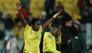 South Africa's defender #14 Tiisetso Makhubela (L) celebrates with teammates their win at the end of match between South Africa and Italy at Wellington Stadium in Wellington on August 2, 2023. (Photo by Marty Melville / AFP)