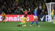 Brazil's defender #04 Rafaelle (2nd R) walks past as Jamaica's players celebrate qualifying for the last 16 in Melbourne on August 2, 2023. (Photo by William West / AFP)