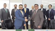 Officials from Domasco and Al Jazeera Finance during the agreement signing ceremony.